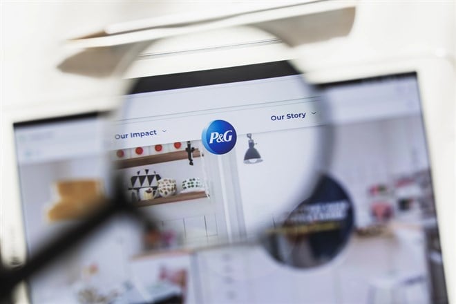 Procter Gamble Company, PG official website homepage under magnifying glass. 