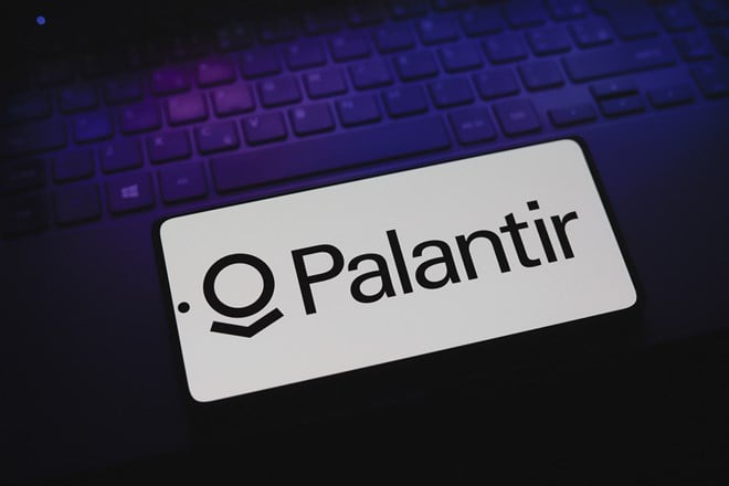 Palantir Technologies logo is displayed on a smartphone screen