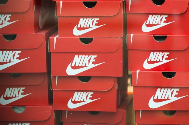 ANTWERP, BELGIUM - JULY 6, 2015: boxes stacked shoes, Nike brand in a window of a shoe store.