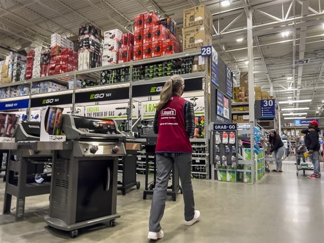 Mill Creek, WA USA - circa June 2022: View of an employee working inside a Lowe's home improvement store