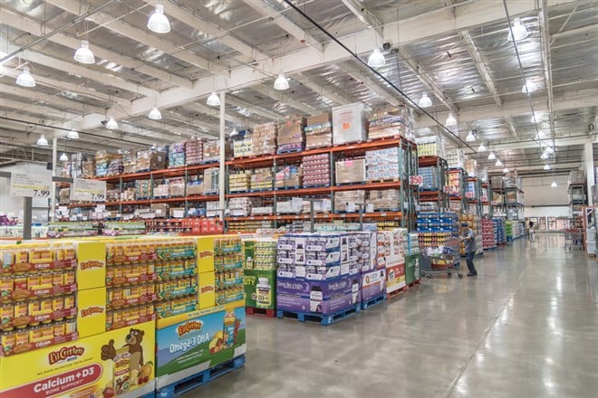 Customer shopping for supplements and multivitamin at Costco Wholesale big-boxes store BJ's Wholesale