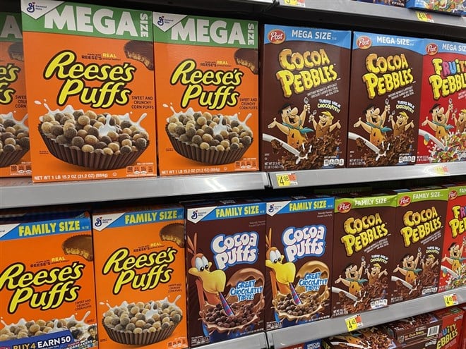 Augusta, Ga USA - 08 18 22: Walmart grocery store interior Reeses Puffs Cocoa Puffs cereals and price Tobacco road