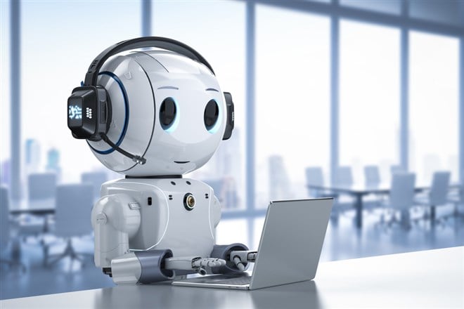 Photo of an AI customer service robot rep with headphones and a computer.