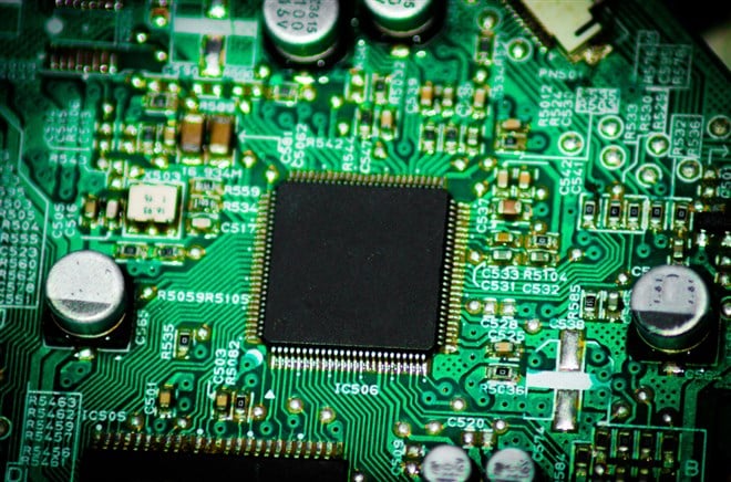 Plant green on a circuit board technology - stock image