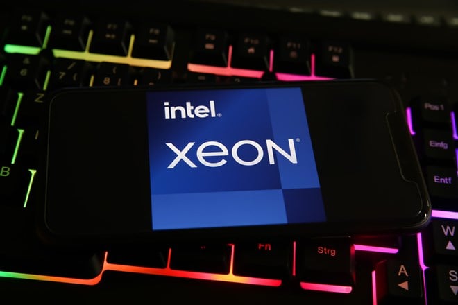 Viersen, Germany - May 8. 2021: Closeup of smartphone with logo lettering of intel xeon processor cpu on computer keyboard