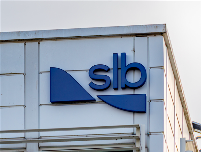 Clamart, France - February 2, 2024: Sign and logo on a building of SLB, formerly Schlumberger. SLB is a French multinational petroleum services and equipment company — Stock Editorial Photography