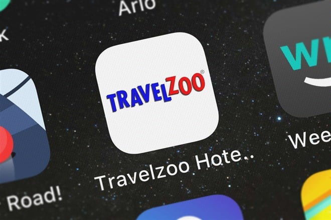 London, United Kingdom - September 30, 2018: The Travelzoo Hotel  Travel Deals mobile app from Travelzoo Inc. on an iPhone screen.