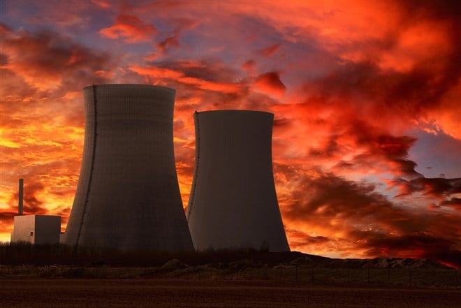 Nuclear power plant with an intense red sky — Photo