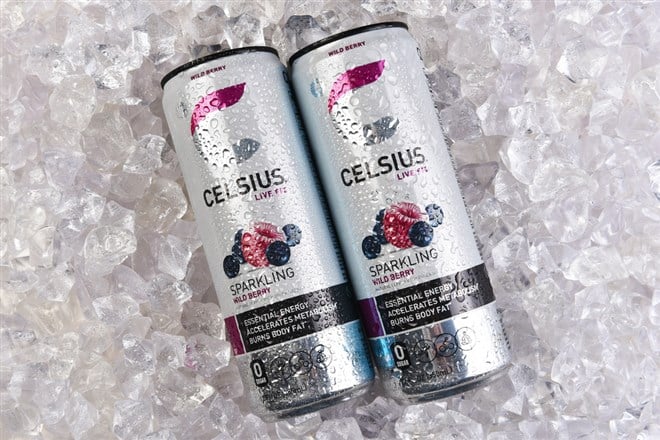 IRVINE, CALIFORNIA - 30 OCT 2024: Two cans of Celsius Live Fit Wild Berry Sparkling Energy Drink on a bed of ice. — Stock Editorial Photography