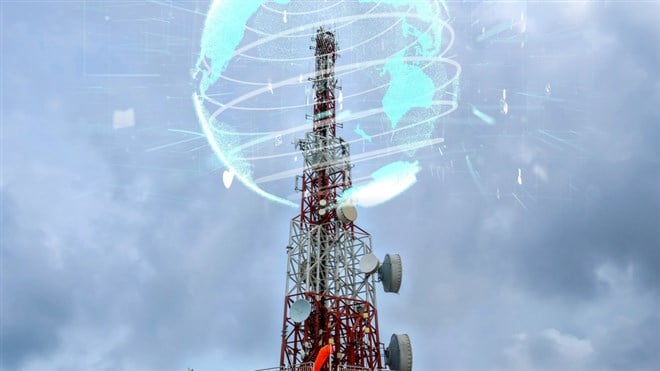 Photo of a tower and radio frequencies and a hologram of the world