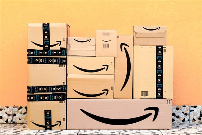 Amazon packages, boxes delivery to the door - Stock Editorial Photography