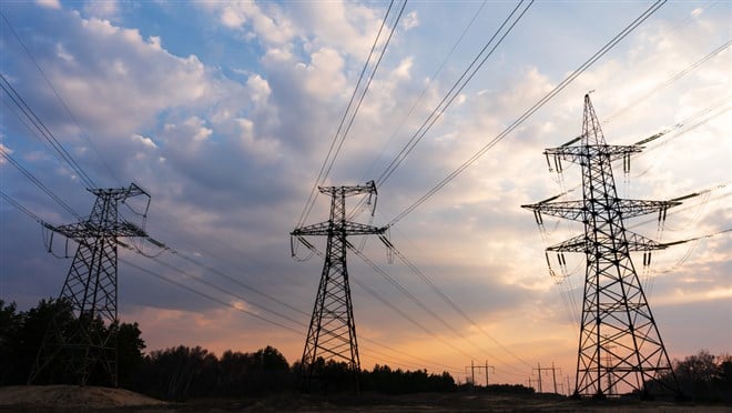 Distribution electric substation with power lines and transformers, at sunset — Photo