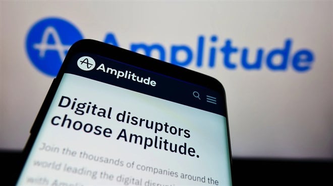 STUTTGART, GERMANY - Dec 13, 2021: Mobile phone with webpage of US analytics software company Amplitude Inc. on screen in front of logo. Focus on top-left of phone display. - Stock Editorial Photography