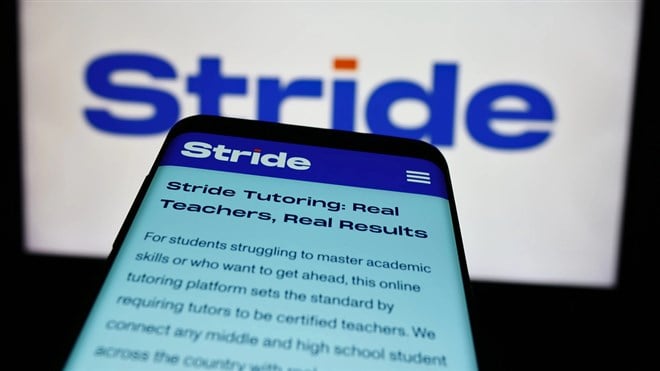 Stuttgart, Germany - 07-08-2024: Mobile phone with webpage of US online education company Stride Inc. in front of business logo. Focus on top-left of phone display. — Stock Editorial Photography