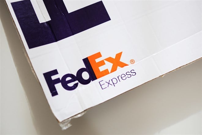 FedEx packaging on white background - Stock Editorial Photography