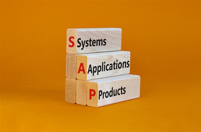 SAP, systems, applications, products symbol. Wooden blocks with words SAP, systems, applications, products. Orange background, copy space. Business and SAP, systems, applications, products concept.