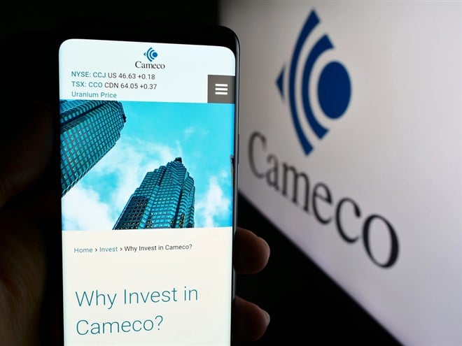 Stuttgart, Germany - 07-21-2024: Person holding cellphone with webpage of Canadian uranium mining company Cameco Corporation in front of logo. Focus on center of phone display. — Stock Editorial Photography