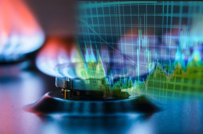 Natural gas cost growth concept with gas burners and stock charts - stock image