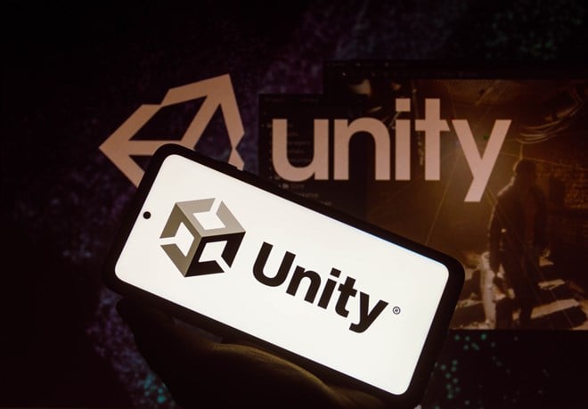 In this photo illustration the Unity Technologies logo seen displayed on a smartphone