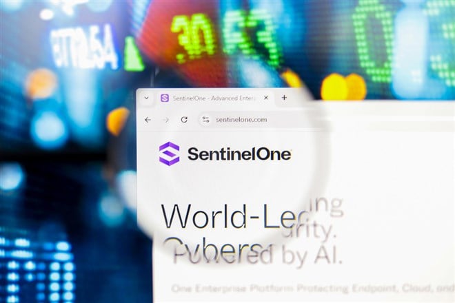 August 30, 2024, Paraguay. In this photo illustration, the SentinelOne, Inc. logo seen displayed on a computer screen through a magnifying glass - Stock Editorial Photography