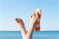 Flip flops and sandals on beach; how to invest for retirement at 40 with little to no savings - how to get to the beach!