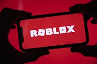 illustration of roblox logo on mobile device on red background