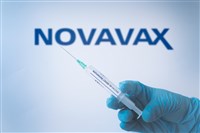 Novavax vaccine syringe close up with Logo behind