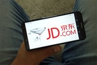 JD.com logo on smartphone