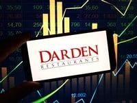 Darden Restaurants logo on smartphone with stock market background