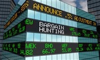 Photo of a stock ticker showing Bargain Hunting and stock prices. Keep reading to learn what a value trap is and how to avoid them.