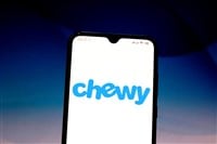 Chewy logo is displayed on a smartphone