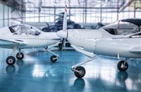 two airplanes in hangar