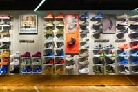 Foot Locker shoe shelves in store