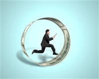 Photo of a businessman running inside a circle made of money symbolic of the wheel options trading strategy. 