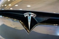 Tesla electric car logo emblem close up