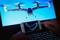 Person holding smartphone with logo of startup and aerospace company.Joby Aviation air taxi on screen.Telsiai,Lithuania.08-09-2023.