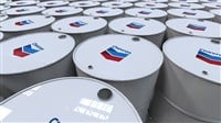 Chevron Editorial photo of crude oil barrels featuring branding from a corporate petrochemical company