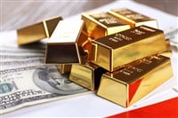 Gold bars with dollar banknotes on paper background