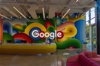 Google sign on the wall behind the reception desk at the Google headquarters in Silicon Valley