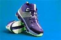 pair of fashionable walking sneakers. Sport shoes. Fashionable street shoes of the QC brand on a blue background