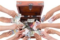 Phto of different hands putting money into one box; concept photo of pooled investment vehicles.