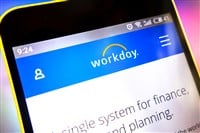 Workday website homepage. Workday logo visible on the phone screen