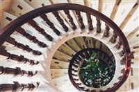 Yellow light in the center of spiral staircase Fibonacci spiral