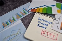 ETFs write on a book isolated on Office Desk. Stock market concept