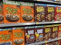 Augusta, Ga USA - 08 18 22: Walmart grocery store interior Reeses Puffs Cocoa Puffs cereals and price Tobacco road