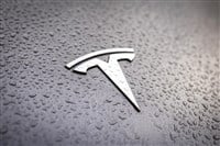 Tesla logo on a grey car