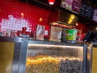 Lynnwood, WA USA - circa July 2023: Angled view of the concession stand counter inside an AMC movie theater.