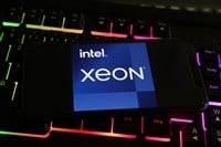 Viersen, Germany - May 8. 2021: Closeup of smartphone with logo lettering of intel xeon processor cpu on computer keyboard