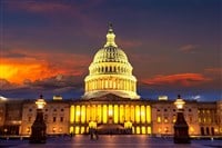 The United States Capitol building at sunset at night in Washington DC, USA