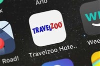 London, United Kingdom - September 30, 2018: The Travelzoo Hotel  Travel Deals mobile app from Travelzoo Inc. on an iPhone screen.